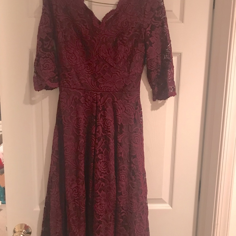 Beautiful 3/4 length sleeve lace Zapaka dress. NEVER worn.